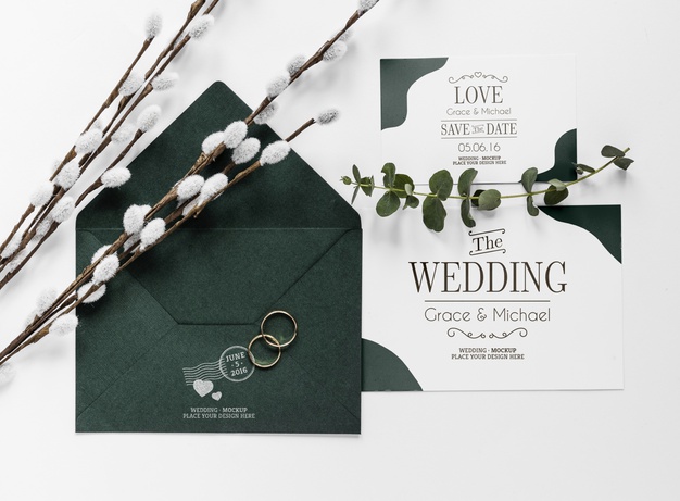 top-view-wedding-cards-with-envelope-rings_23-2148530359